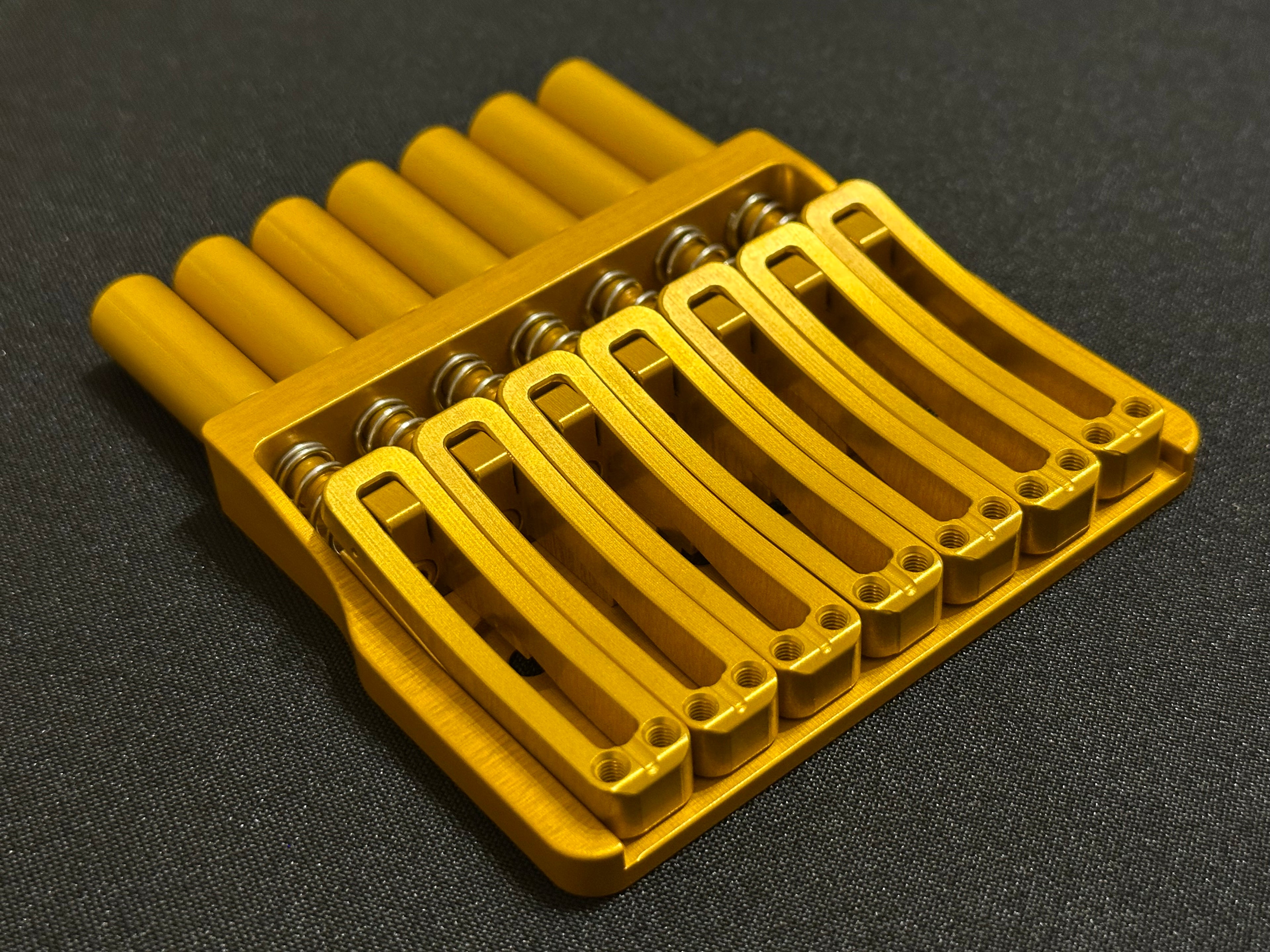 Rakhvari 7 String Hardtail Bridge - Gold Baseplate / Gold Hardware