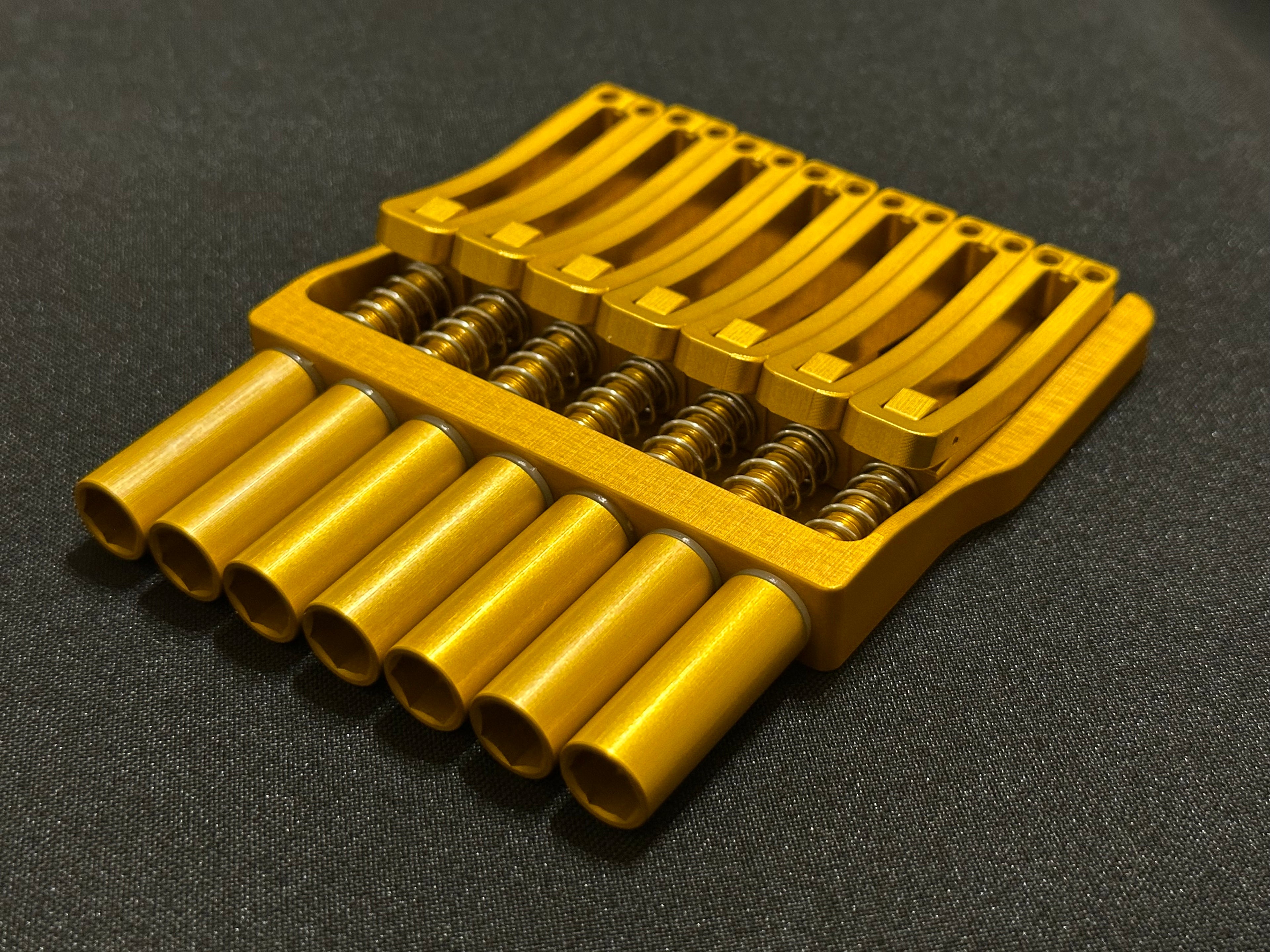 Rakhvari 7 String Hardtail Bridge - Gold Baseplate / Gold Hardware