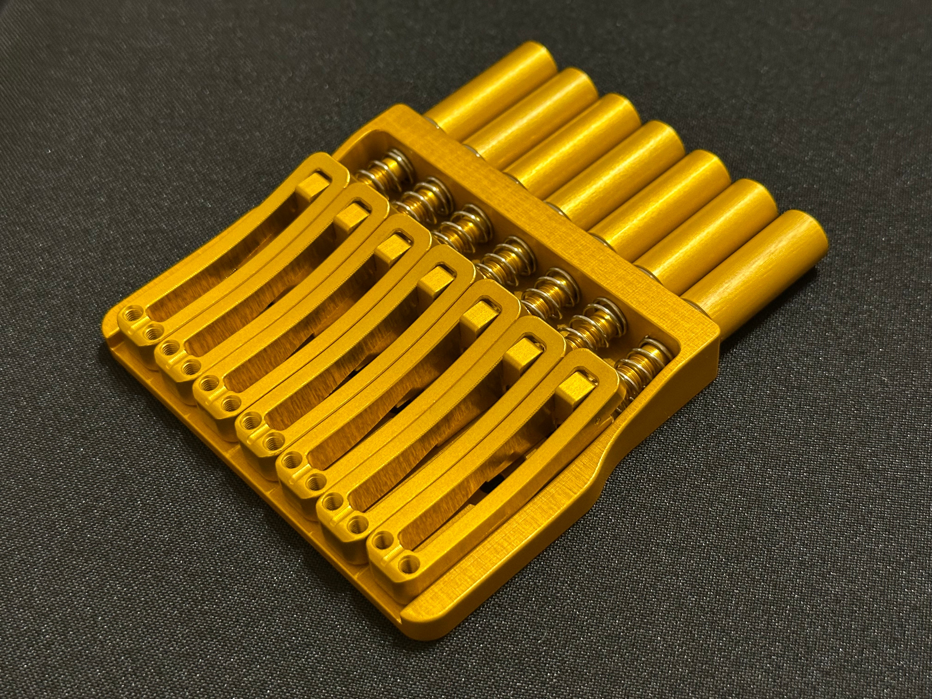 Rakhvari 7 String Hardtail Bridge - Gold Baseplate / Gold Hardware
