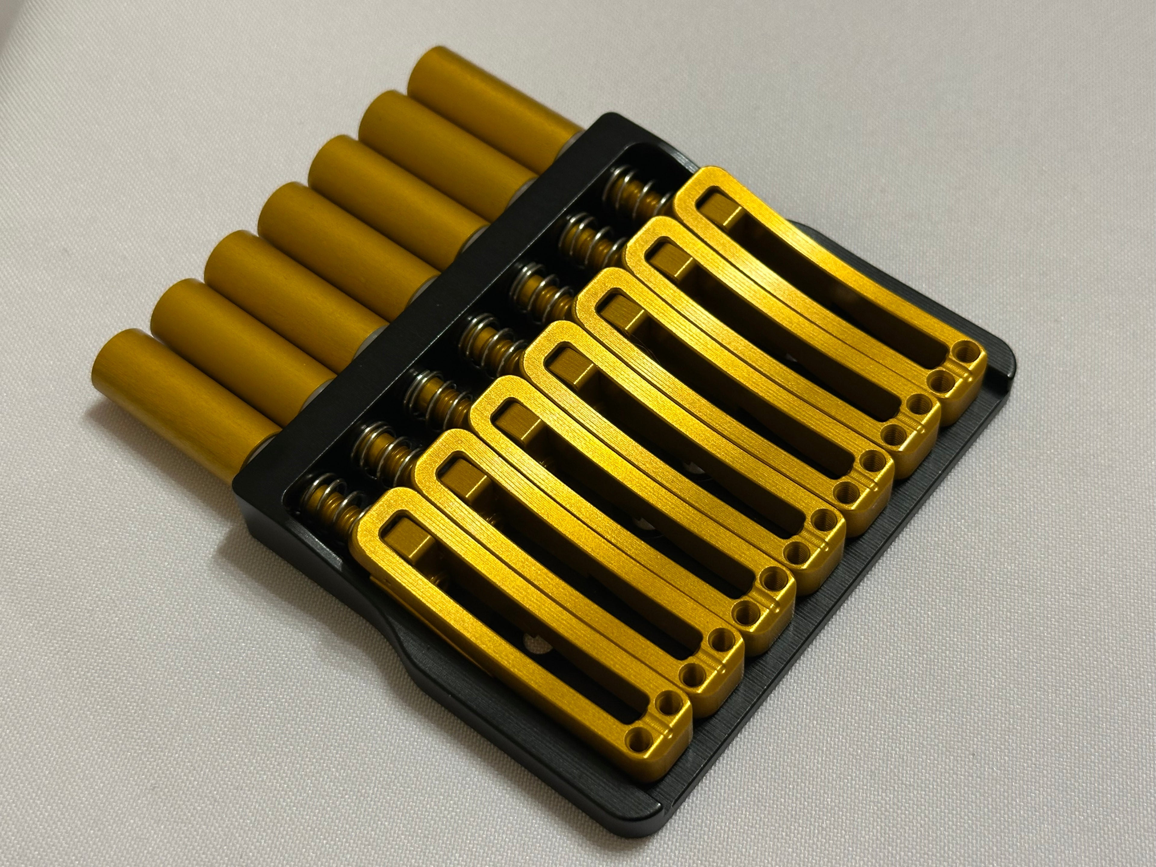 Rakhvari 7 String Hardtail Bridge - Black Baseplate / Gold Hardware