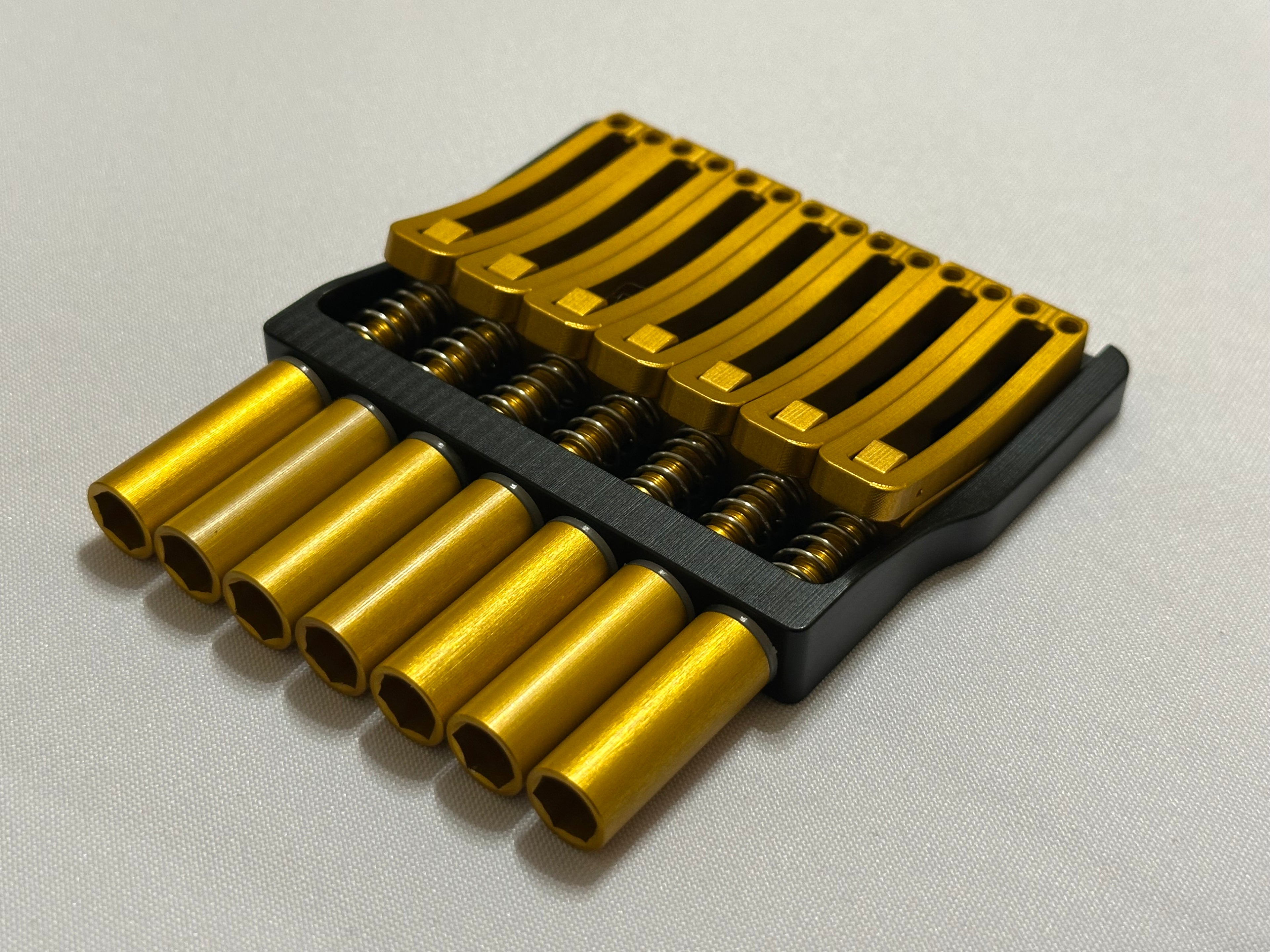 Rakhvari 7 String Hardtail Bridge - Black Baseplate / Gold Hardware