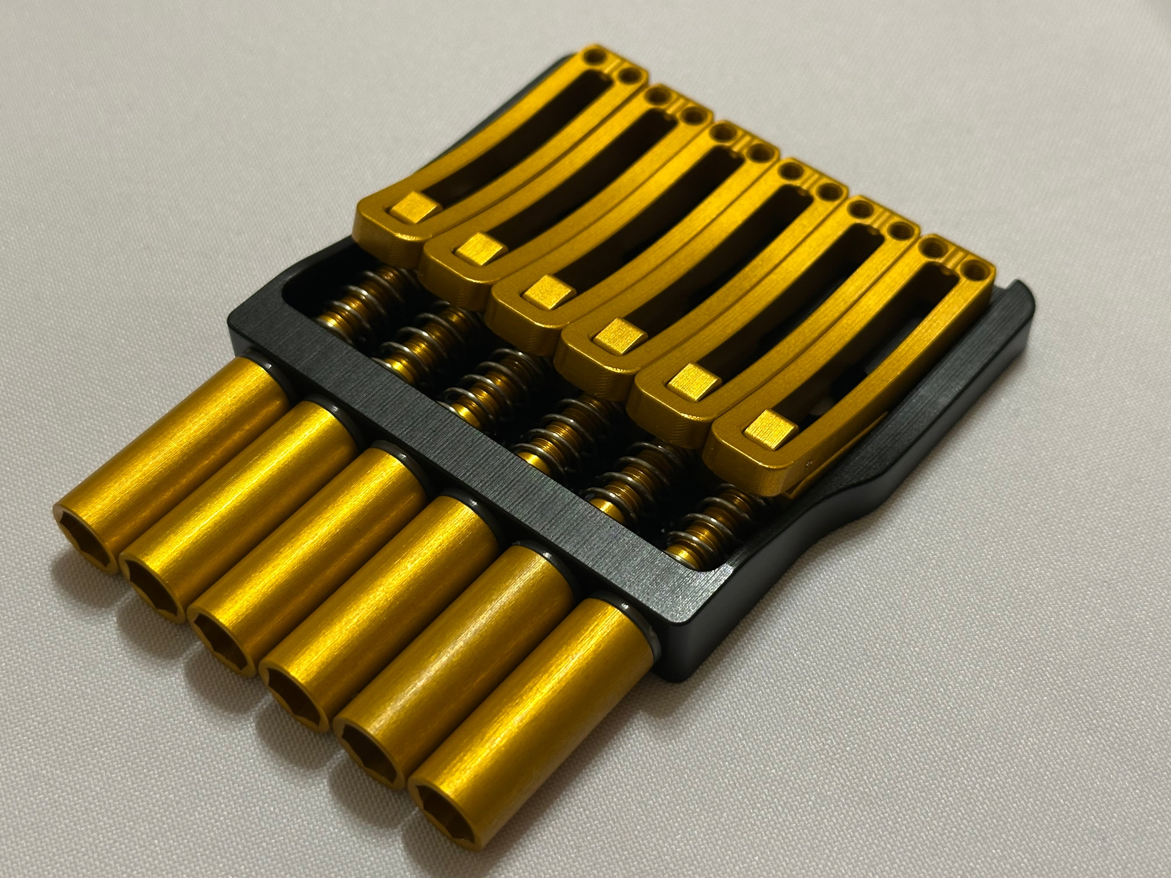 Rakhvari 6 String Hardtail Bridge - Black Baseplate / Gold Hardware