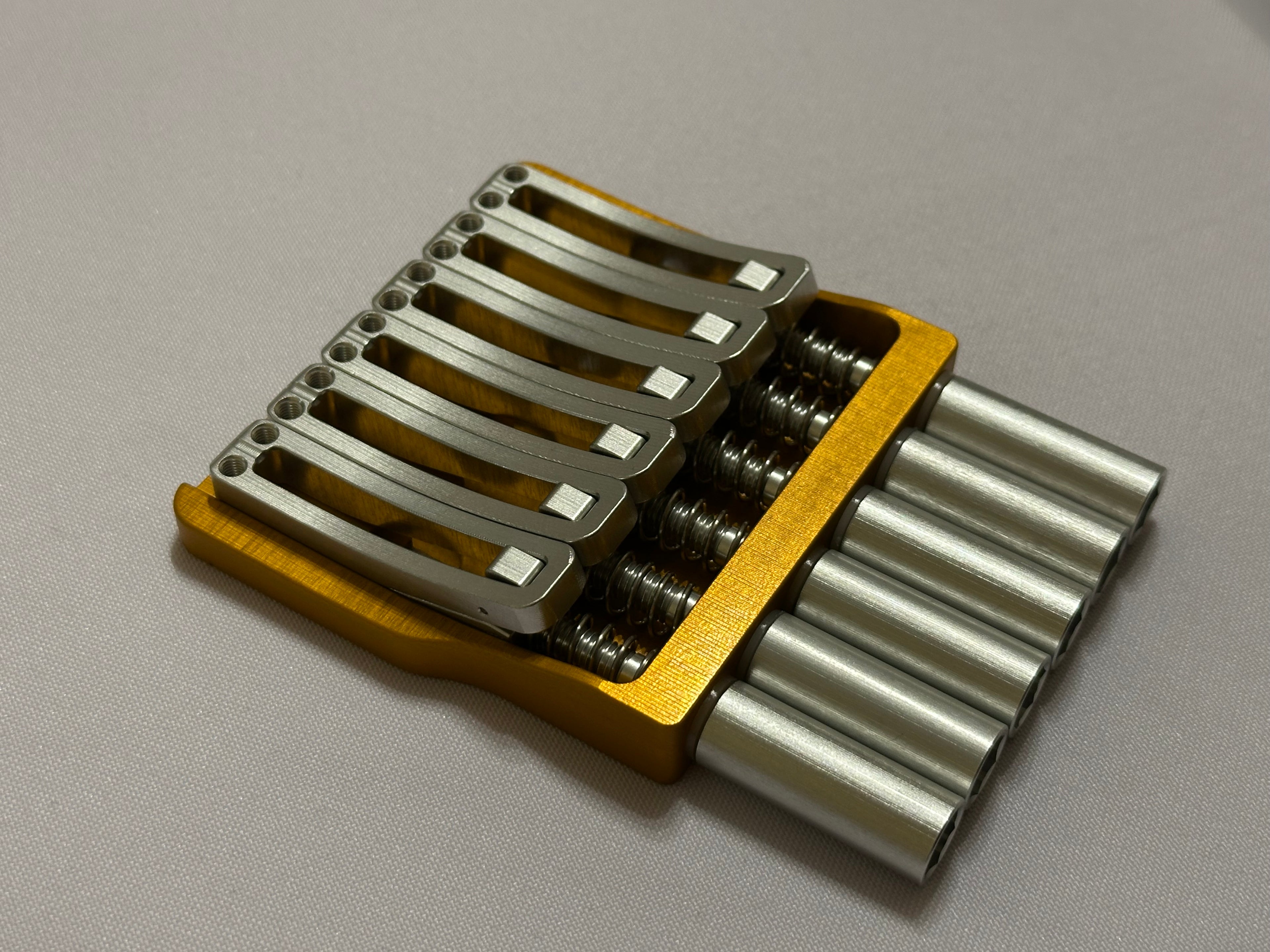 Rakhvari 6 String Hardtail Bridge - Gold Baseplate / Silver Hardware