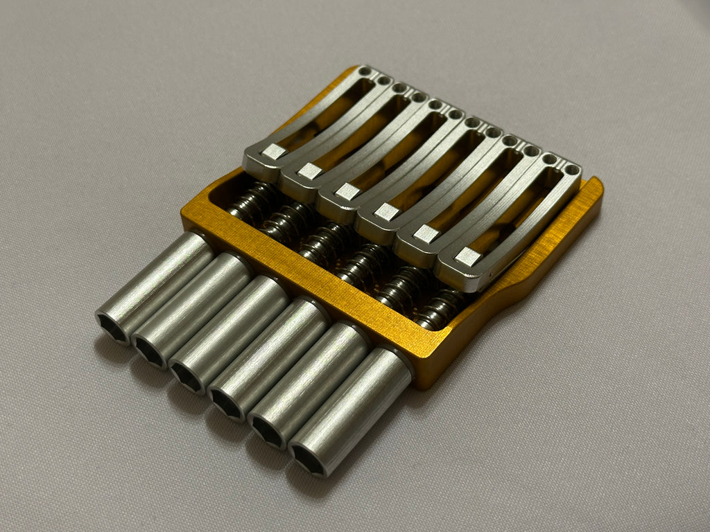Rakhvari 6 String Hardtail Bridge - Gold Baseplate / Silver Hardware