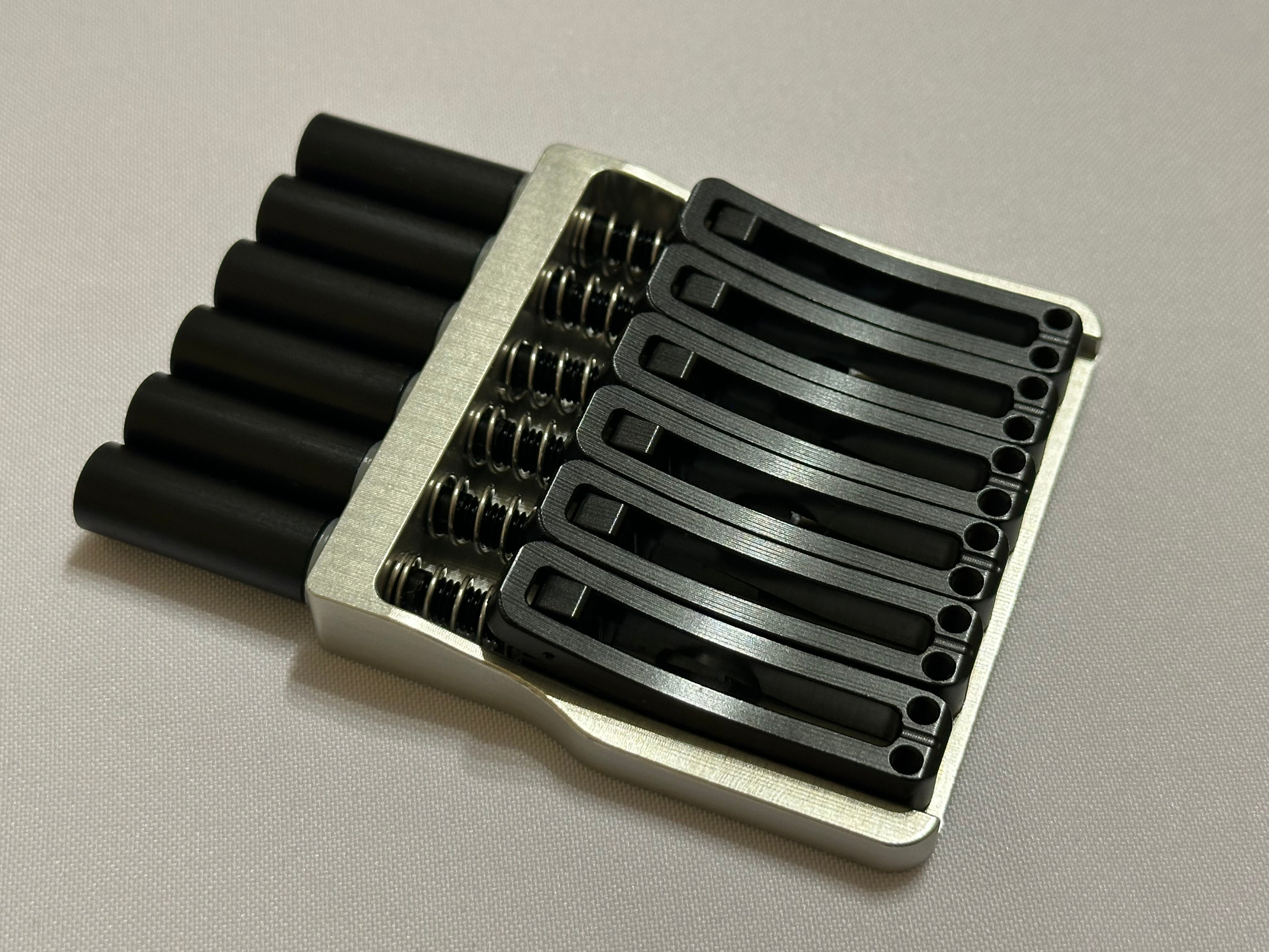 Rakhvari 6 String Hardtail Bridge - Silver Baseplate / Black Hardware