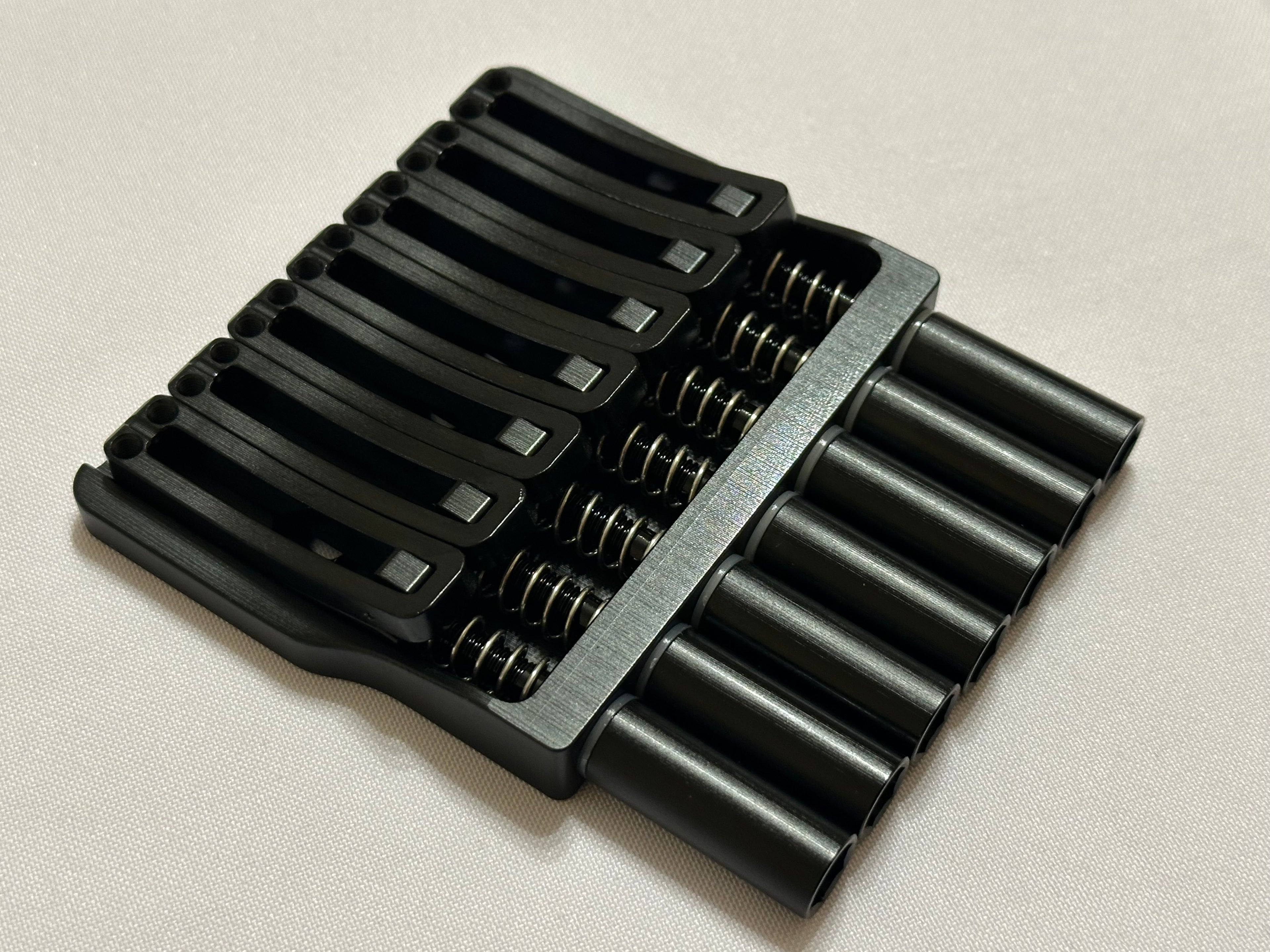 Rakhvari 7 String Hardtail Bridge - Gold Baseplate / Black Hardware