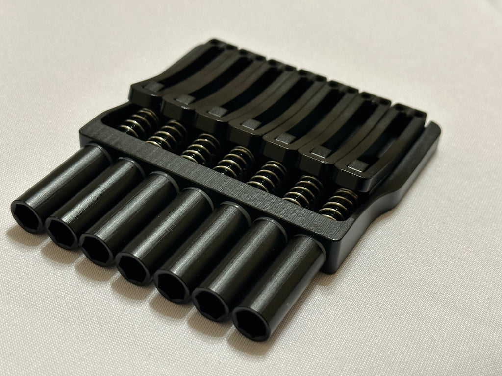 Rakhvari 7 String Hardtail Bridge - Gold Baseplate / Black Hardware