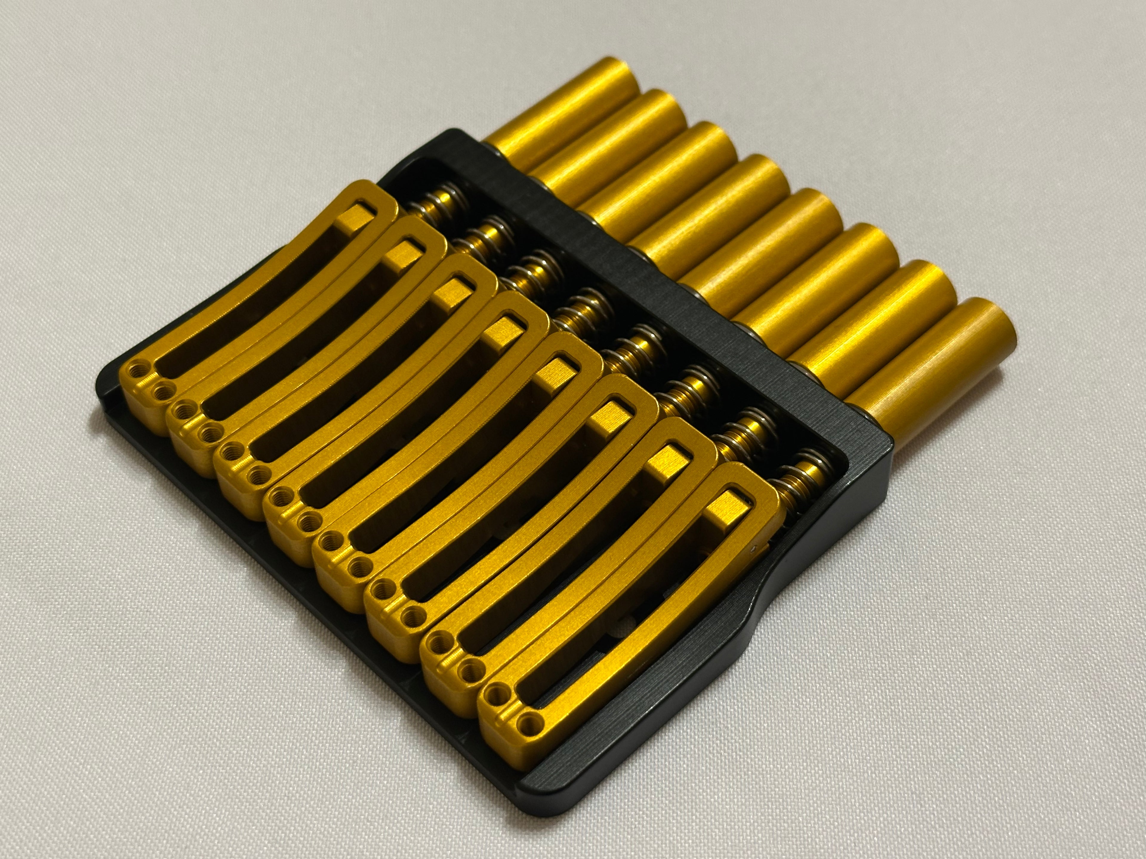 Rakhvari 8 String Hardtail Bridge - Black Baseplate / Gold Hardware