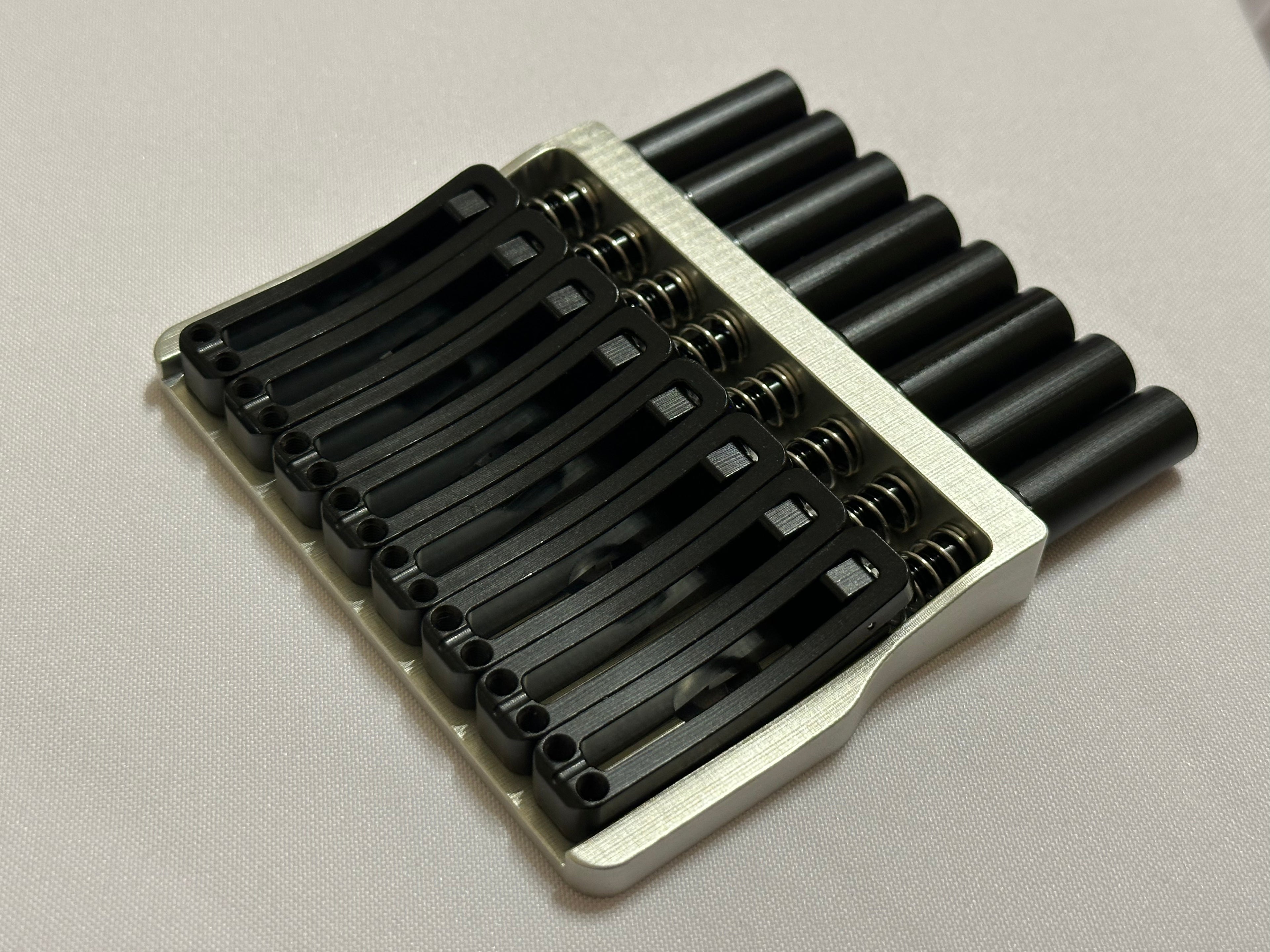 Rakhvari 8 String Hardtail Bridge - Silver Baseplate / Black Hardware