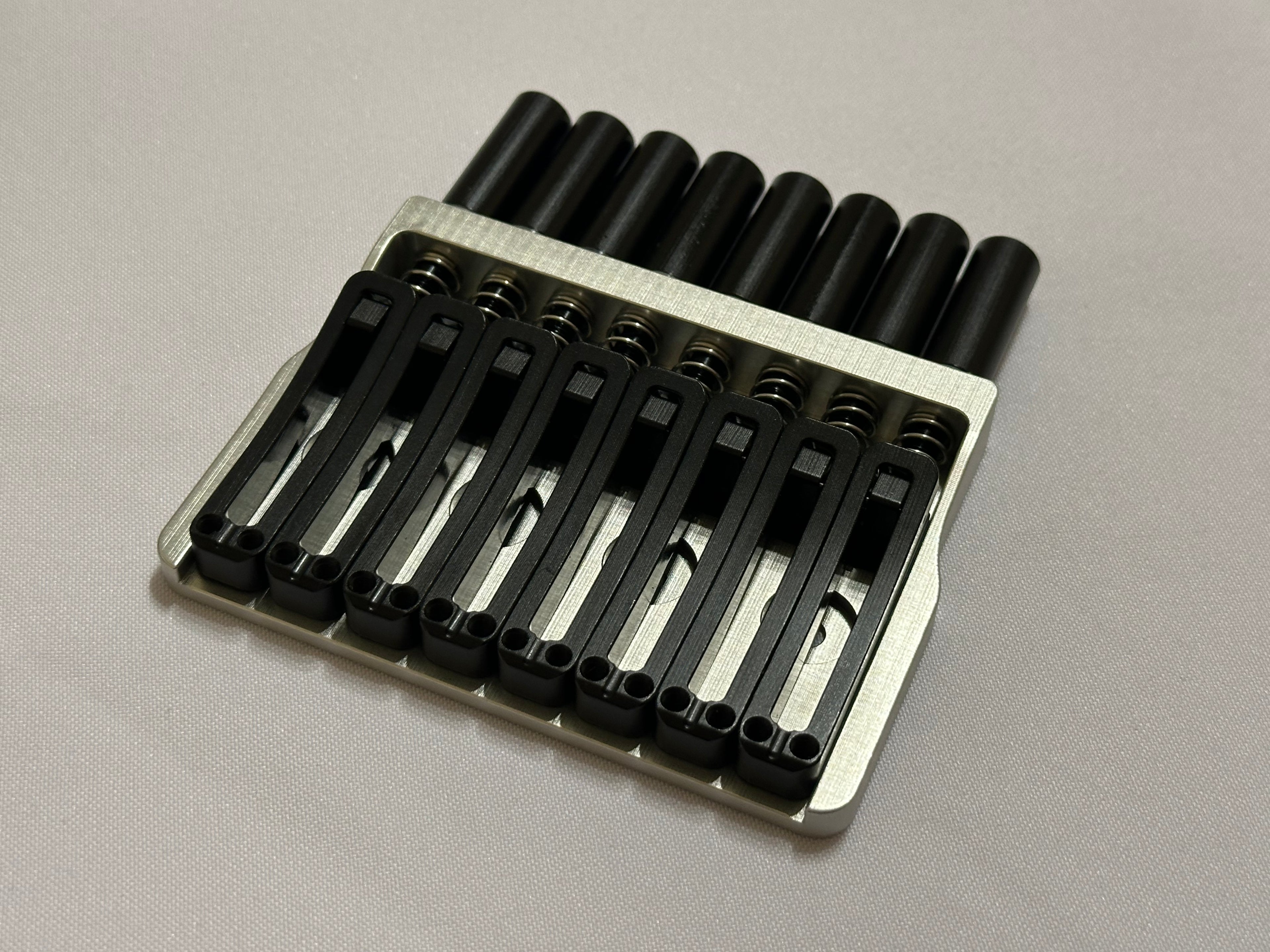 Rakhvari 8 String Hardtail Bridge - Silver Baseplate / Black Hardware