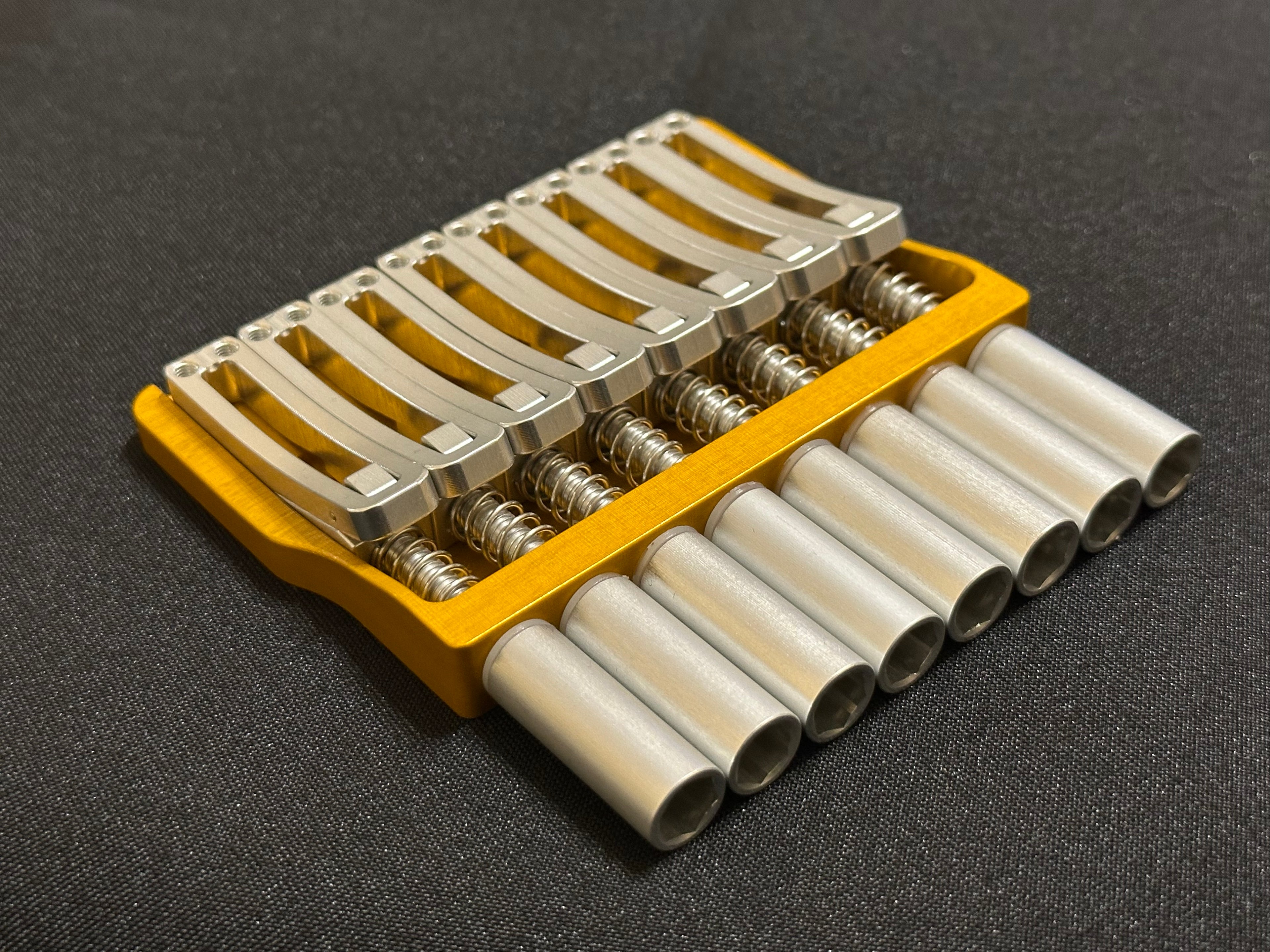 Rakhvari 8 String Hardtail Bridge - Gold Baseplate / Silver Hardware